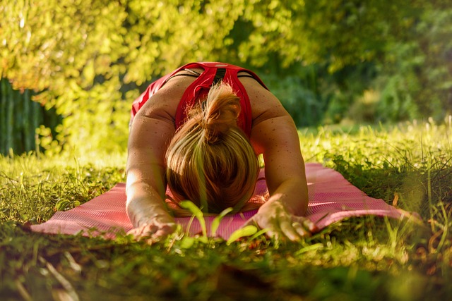 woman performing daily stretching routine at home near a window